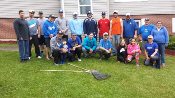 Members of the 2015 Peterbilt DQ Royals taking a break from yard work. The team lent a hand at Chrysalis House for some spring cleaning.